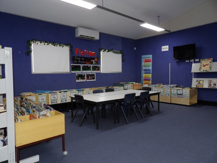 A quiet reading area in a library with many books to choose from